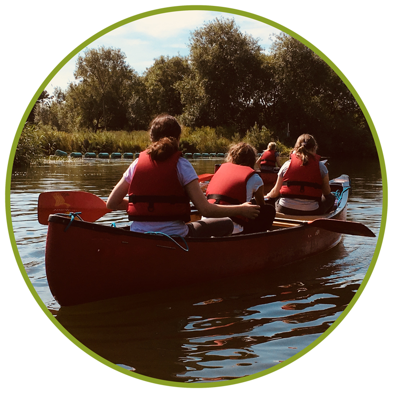 Boundless Outdoors Centres, group of girls rowing a canoe